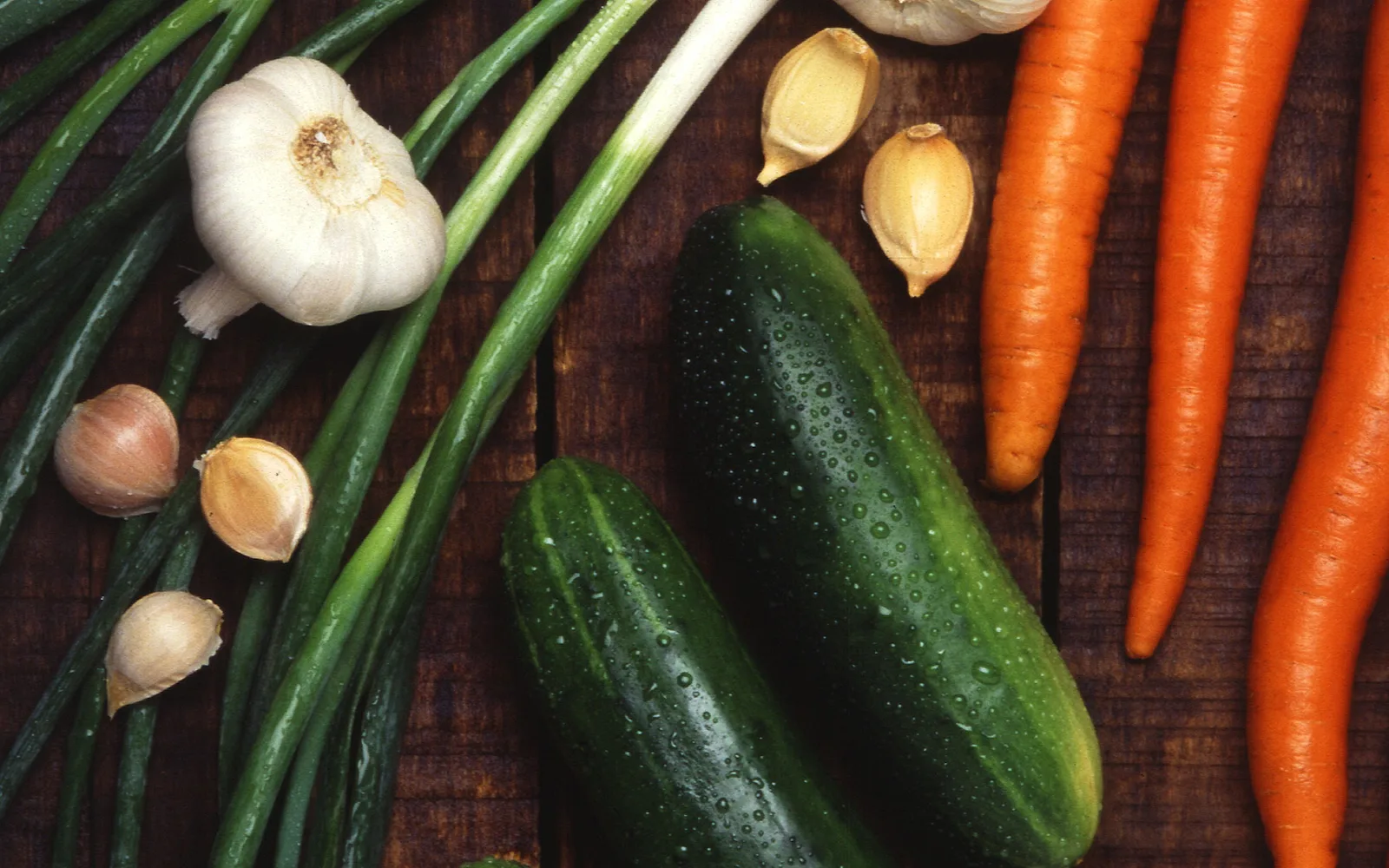 Mixed fresh vegetables including lettuce, tomatoes, and other produce